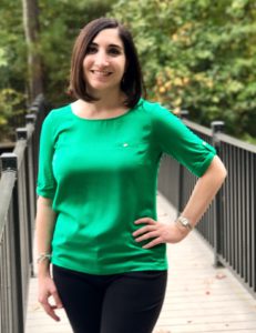 Dr. Sabine Schtakleff, smiling, in an emerald green blouse.